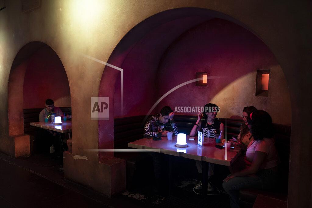 Jae C. Hong Customers chat at Scum and Villainy Cantina, a bar located on Hollywood Blvd, in Los Angeles, Tuesday, May 4, 2021. California has the lowest infection rate in the country. Los Angeles County, which is home to a quarter of the state's nearly 40 million people and has endured a disproportionate number of the state's 60,000 deaths, didn't record a single COVID-19 death Sunday or Monday, which was likely due to incomplete weekend reporting but still noteworthy. (AP Photo/Jae C. Hong)