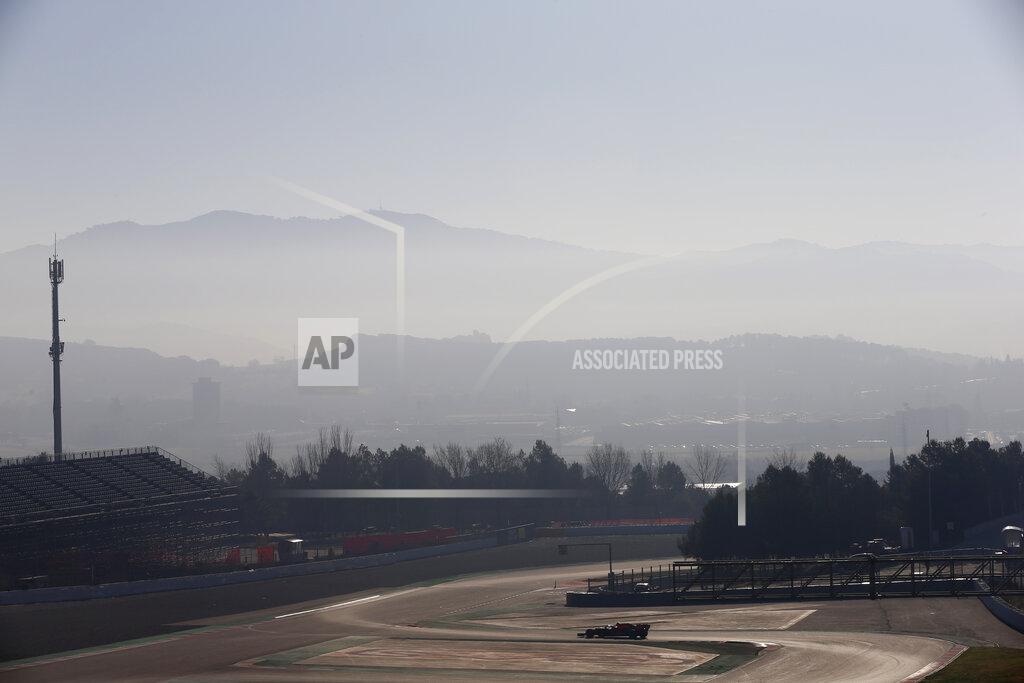 Joan Monfort A lone car drives on the track during a Formula One pre-season testing session at the Barcelona Catalunya racetrack in Montmelo, outside Barcelona, Spain, Wednesday, Feb. 27, 2019. (AP Photo/Joan Monfort)