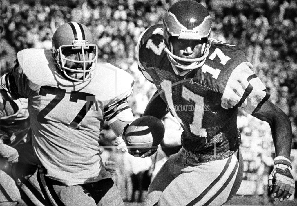 Gene Puskar FILE - In this Nov. 4, 1979, file photo, Philadelphia Eagles' Harold Carmichael (17) pulls away from Cleveland Browns' Lyle Alzado (77) after catching a pass during the first half of an NFL football game in Philadelphia. Carmichael used his size to outjump and overpower defenders, catching more passes for more yards and touchdowns than any player in the history of the Philadelphia Eagles. The gentle giant then waited patiently for three decades before he was elected to the Pro Football Hall of Fame as part of last year’s special centennial class.(AP Photo/Gene Puskar, File)