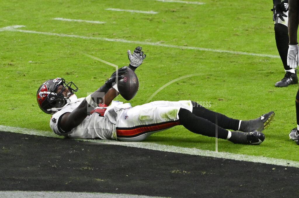 David Becker Tampa Bay Buccaneers wide receiver Chris Godwin (14) celebrates after making a reception for a gain against the Las Vegas Raiders during the second half of an NFL football game, Sunday, Oct. 25, 2020, in Las Vegas. (AP Photo/David Becker)