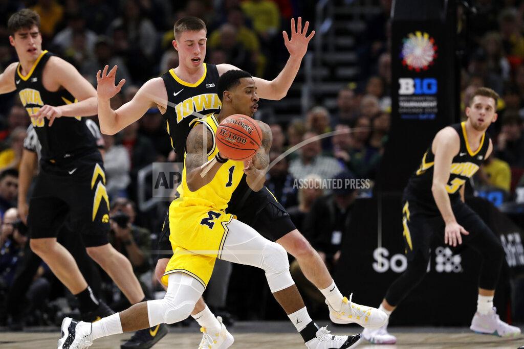 Nam Y. Huh Michigan's Charles Matthews (1) drives past Iowa's Maishe Dailey during the first half of an NCAA college basketball game in the quarterfinals of the Big Ten Conference tournament, Friday, March 15, 2019, in Chicago. (AP Photo/Nam Y. Huh)