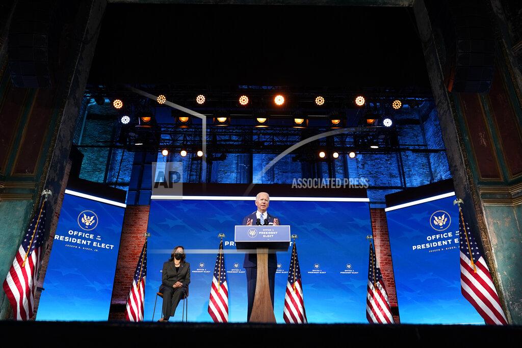 Matt Slocum President-elect Joe Biden speaks about the COVID-19 pandemic during an event at The Queen theater, Thursday, Jan. 14, 2021, in Wilmington, Del., as Vice President-elect Kamala Harris listens. (AP Photo/Matt Slocum)