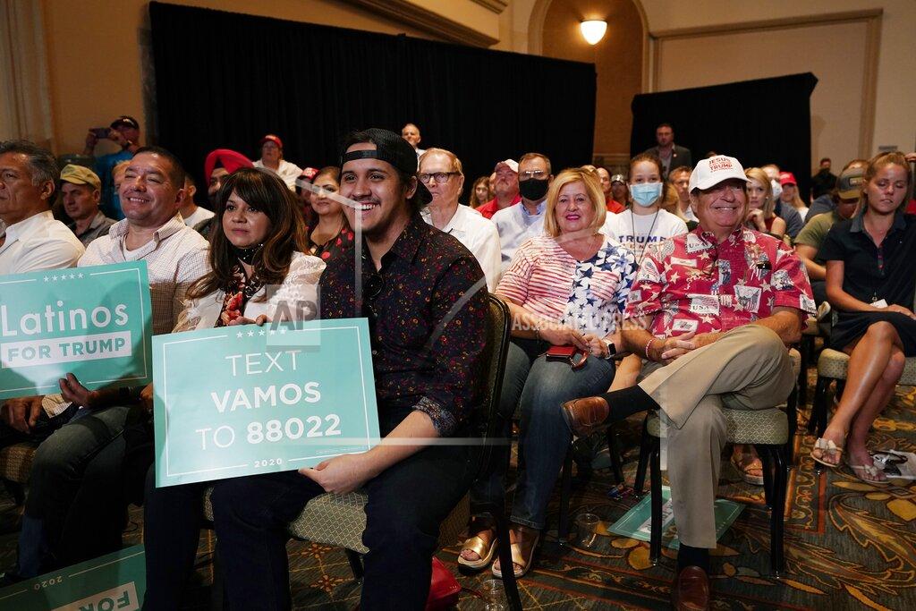 Ross D. Franklin The crowd listens to President Donald Trump speak as he participates in a Latinos for Trump Coalition roundtable Monday, Sept. 14, 2020, in Phoenix. (AP Photo/Ross D. Franklin)