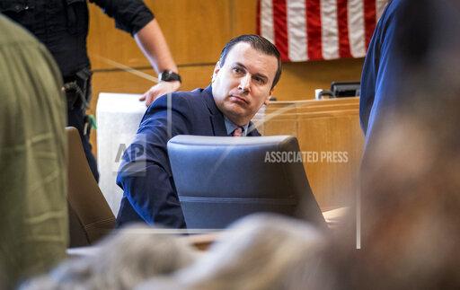Charged with capital murder, William George Davis listens to closing arguments in court, Tuesday, Oct. 19, 2021, in Tyler, Texas, as he stands trial for the deaths of four patients at Christus Trinity Mother Frances Hospital in Tyler in 2017 and 2018. (Les Hassell/Longview News-Journal via AP)