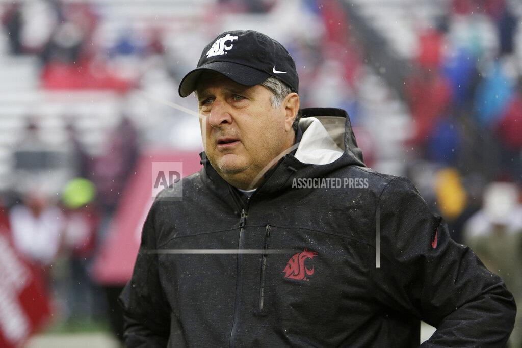 Young Kwak FILE - In this Oct. 19, 2019, file photo, Washington State head coach Mike Leach walks onto the field before an NCAA college football game against Colorado, in Pullman, Wash. Two people with knowledge of the decision says Mississippi State has hired Washington State's Mike Leach as its new head coach. The people spoke to The Associated Press on condition of anonymity Thursday, Jan. 9, 2020, because the school has not yet officially announced the move. Leach will replace Joe Moorhead, who was fired last week after two seasons. (AP Photo/Young Kwak, File)