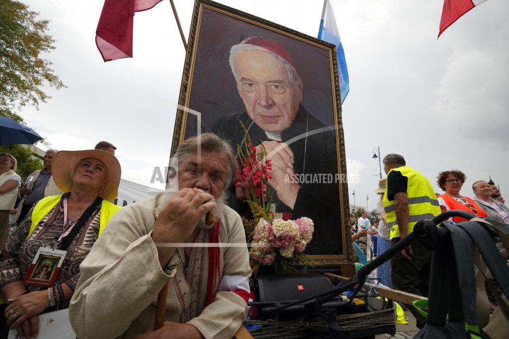 Czarek Sokolowski Catholic faithful attend the beatification ceremony of Polish Cardinal Stefan Wyszynski and Mother Elzbieta Roza Czacka in front of the church of Providence in Warsaw, Poland, Sunday, Sept. 12, 2021. Poland's top political leaders gathered in a Warsaw church Sunday for the beatification of two revered figures of the Catholic church — a cardinal who led the Polish church's resistance to communism and a blind nun who devoted her life to helping others who couldn't see. (AP Photo/Czarek Sokolowski)