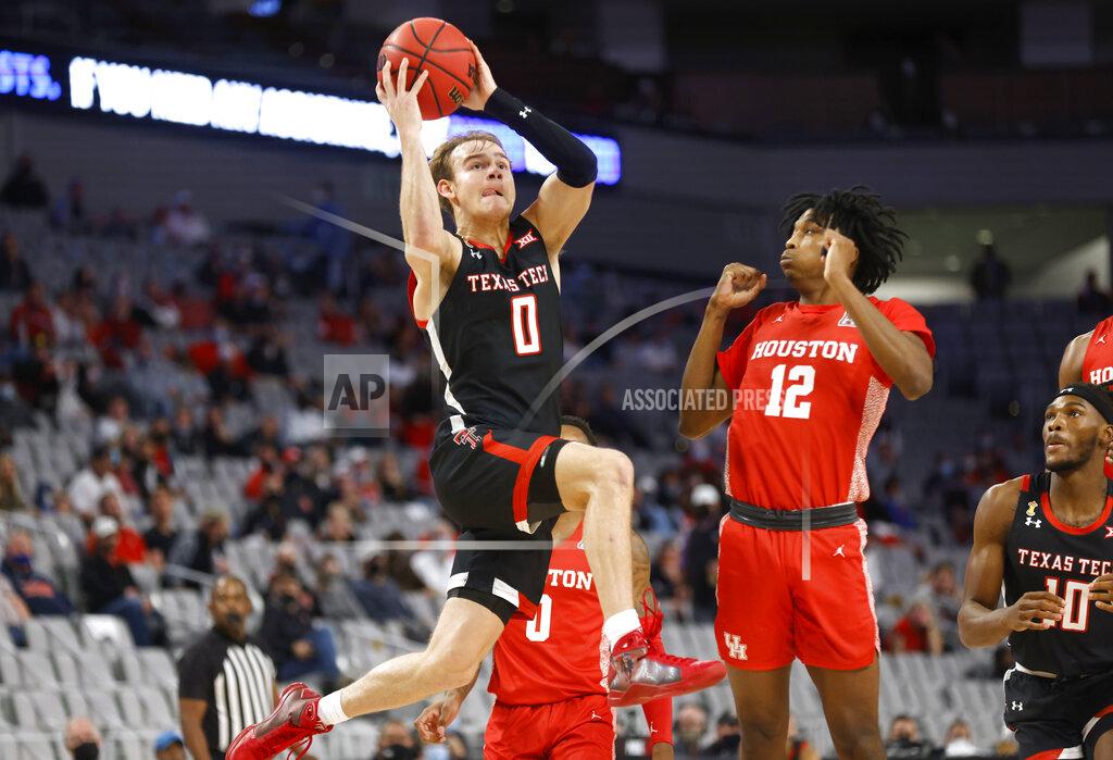 Ron Jenkins Texas Tech guard Mac McClung (0) drives inside as Houston guard Tramon Mark (12) defends during the first half of an NCAA college basketball game, Sunday, Nov. 29, 2020, in Fort Worth, Texas. (AP Photo/Ron Jenkins)