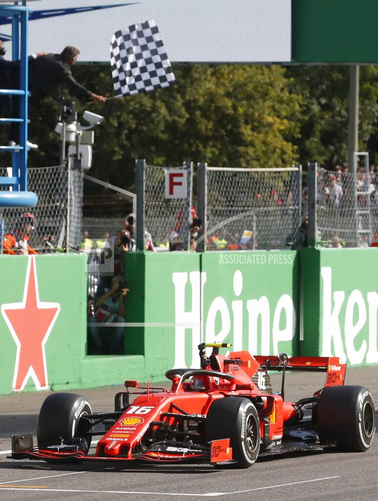 Antonio Calanni Ferrari driver Charles Leclerc of Monaco crosses the finish line to win the Formula One Italy Grand Prix at the Monza racetrack, in Monza, Italy, Sunday, Sept.8, 2019. (AP Photo/Antonio Calanni)