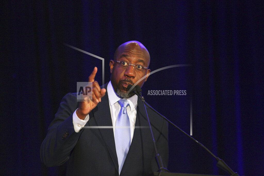 Akili-Casundria Ramsess Sen. Raphael Warnock, D-Ga., addresses the Gwinnett County Democratic Party fundraiser on Saturday, May 21, 2022 in Norcross, Ga. (AP Photo/Akili-Casundria Ramsess)