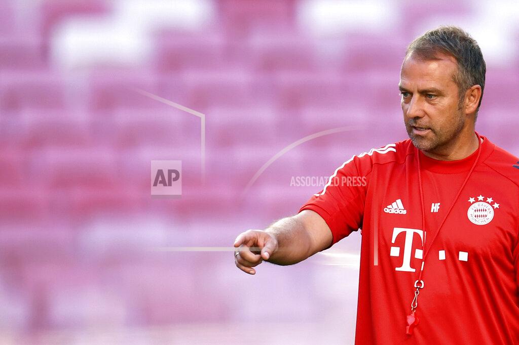 David Ramos Bayern's coach Hans-Dieter Flick directs a training session at the Luz stadium in Lisbon, Saturday Aug. 22, 2020. Bayern Munich will play PSG in the Champions League final soccer match on Sunday. (David Ramos/Pool via AP)