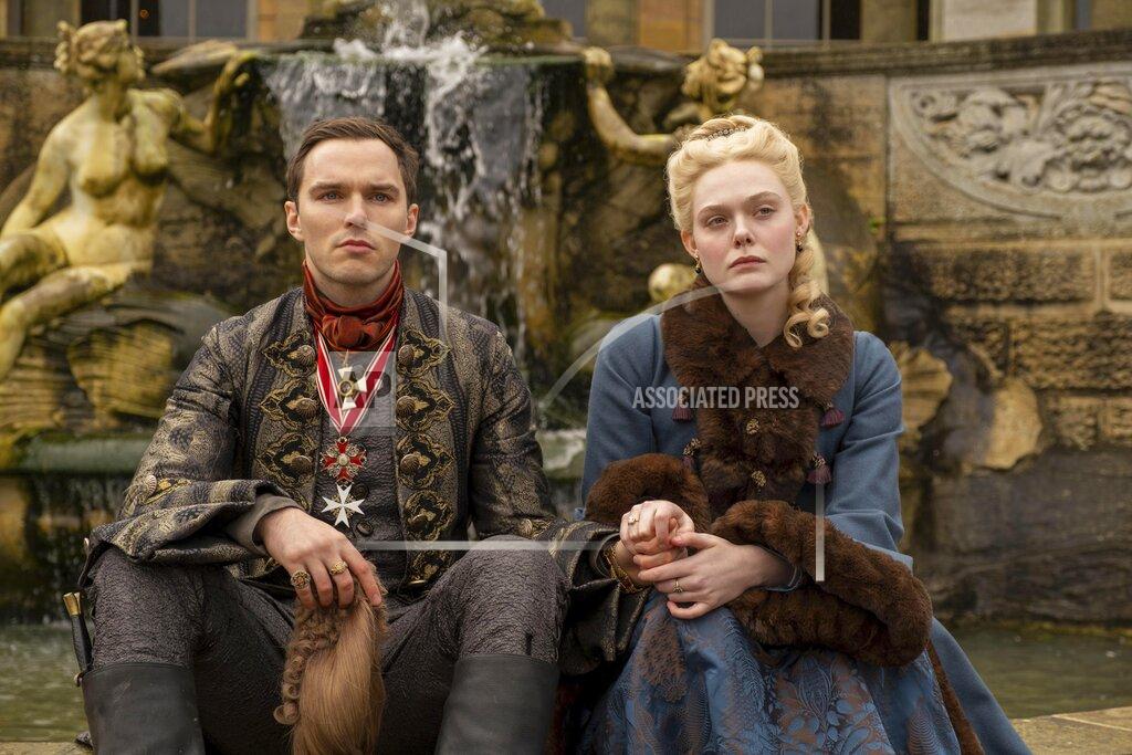 Ollie Upton This image released by Hulu shows Nicholas Hoult, left, and Elle Fanning in a scene from "The Great." The Screen Actors Guild has nominated the cast for a SAG Award for best ensemble in a comedy series. (Ollie Upton/Hulu via AP)