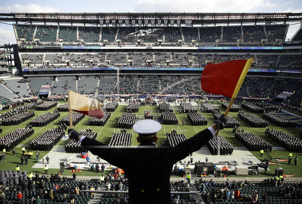Matt Rourke Navy Midshipman Frey Pankratz singles his classmates as they march onto the field ahead of an NCAA college football against the Army, Saturday, Dec. 8, 2018, in Philadelphia. (AP Photo/Matt Rourke)