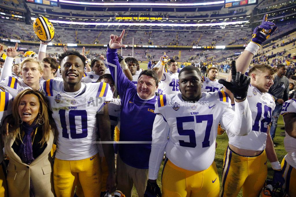 Gerald Herbert LSU coach Ed Orgeron sings the school alma mater with his team after an NCAA college football game against Rice in Baton Rouge, La., Saturday, Nov. 17, 2018. LSU won 42-10. (AP Photo/Gerald Herbert)
