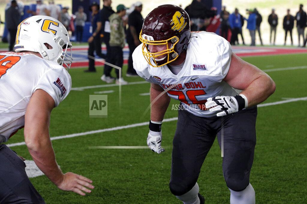 Butch Dill National Team offensive lineman Cole Strange of UT-Chattanooga and offensive lineman Bernhard Raimann of Central Michigan run through drills during practice for the Senior Bowl NCAA college football game Thursday, Feb. 3, 2022, in Mobile, Ala. (AP Photo/Butch Dill)