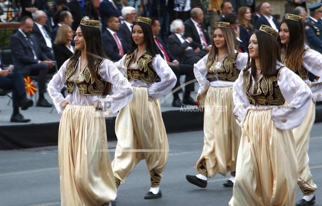 Boris Grdanoski Women in traditional clothing take part in a parade to mark the Independence Day in downtown Skopje, North Macedonia, Wednesday, Sept. 8, 2021. North Macedonia is celebrating Wednesday the 30th anniversary since its independence from former Yugoslavia. (AP Photo/Boris Grdanoski)