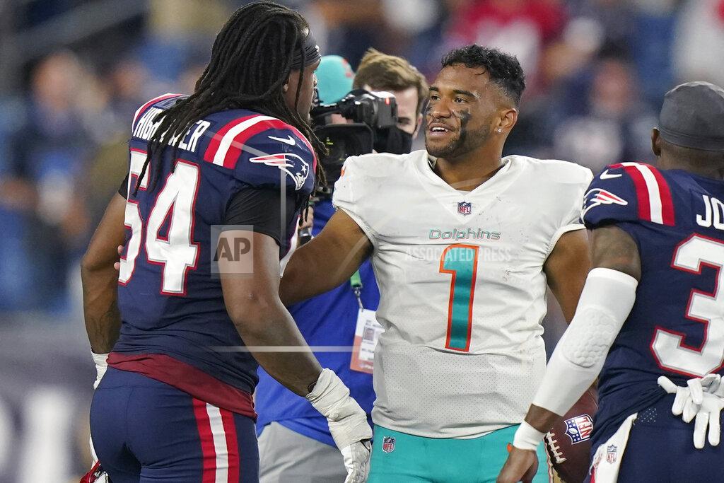 Steven Senne Miami Dolphins quarterback Tua Tagovailoa (1) talks with New England Patriots outside linebacker Dont'a Hightower (54) after an NFL football game, Sunday, Sept. 12, 2021, in Foxborough, Mass. (AP Photo/Steven Senne)
