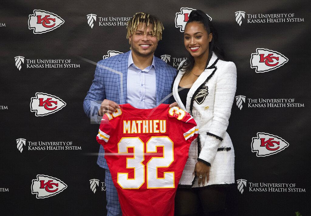 Kansas City Chiefs new safety Tyrann Mathieu poses with his longtime girlfriend Sydni Paige Russell during an NFL football news conference Thursday, March 14, 2019 at the team's practice facility in Kansas City, Mo. (Tammy Ljungblad/The Kansas City Star via AP)
