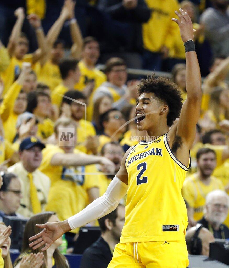 Michigan guard Jordan Poole acknowledges the fans in the closing seconds of the team's NCAA college basketball game against Ohio State, Tuesday, Jan. 29, 2019, in Ann Arbor, Mich. (AP Photo/Carlos Osorio)