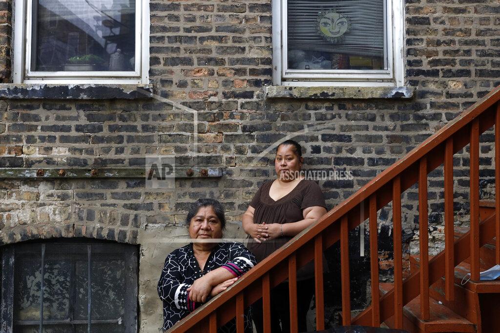 Shafkat Anowar Maria Elena Estamilla, 62, left and her daughter Esmeralda Triquiz pose for a photo June 30, 2021, in Chicago's Pilsen neighborhood. Estamilla's last full medical exam was in 2015 and she sees no options for care as a Mexican immigrant without legal permission to live in the U.S. She's not eligible for Medicare, Medicaid or Affordable Care Act coverage. As a child care worker, she didn't have employer coverage. She can't afford private insurance. (AP Photo/Shafkat Anowar)