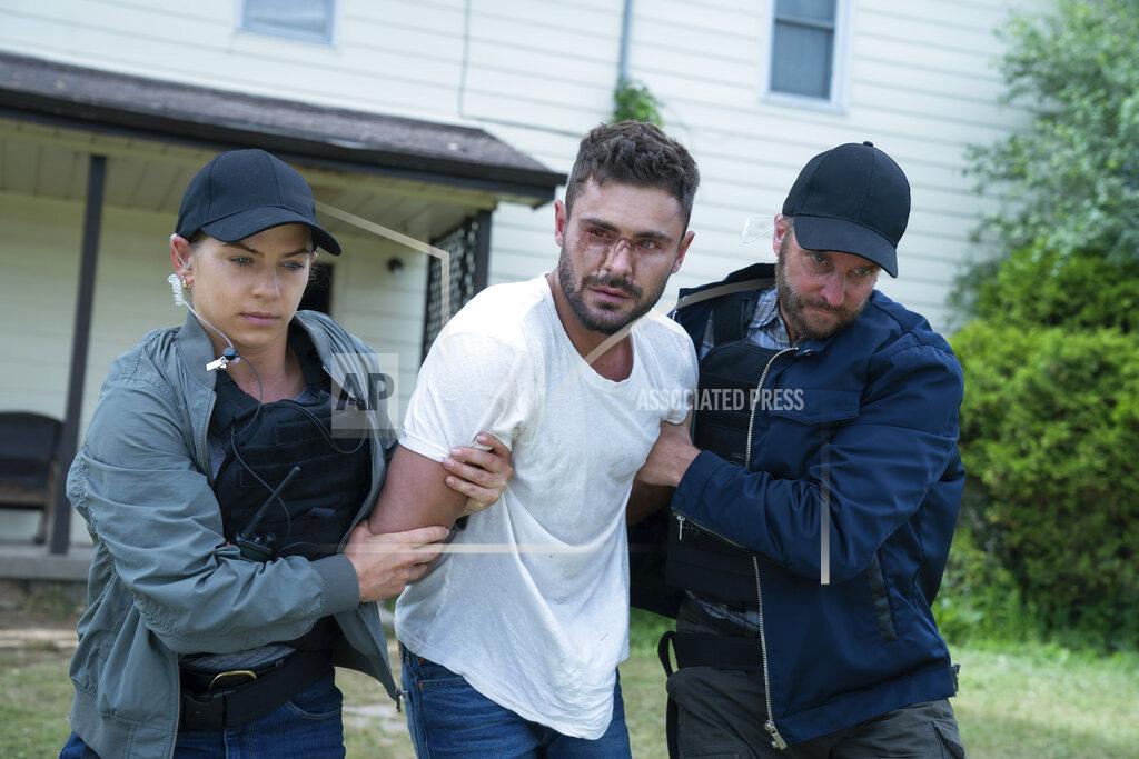 Ken Woroner This image released by Universal Pictures shows Zac Efron, center, in a scene from "Firestarter." (Ken Woroner/Universal Pictures via AP)