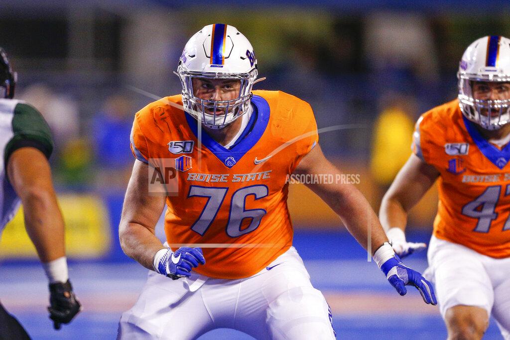 Steve Conner FILE - In this Oct. 12, 2019, file photo, Boise State offensive lineman Ezra Cleveland (76) is shown during the first half of an NCAA college football game against Hawaii in Boise, Idaho. Cleveland is a possible pick in the NFL Draft which runs Thursday, April 23, 2020, thru Saturday, April 25. (AP Photo/Steve Conner, File)