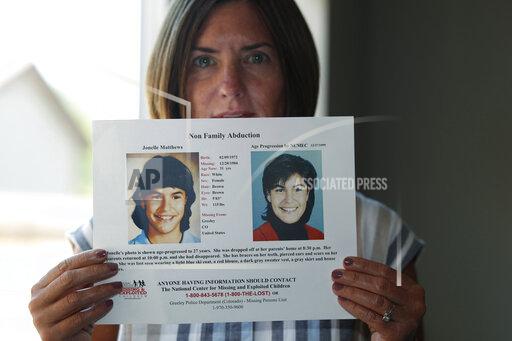 FILE - In this Aug. 12, 2019, file photo, Jennifer Mogensen holds a poster of her adopted sister, Jonelle Matthews, who went missing and whose remains were found recently in Greeley, Colo. The trial for Steve Pankey, a former longshot candidate for Idaho governor who has been indicted in the murder of Jonelle Matthews, is set to begin Wednesday, Oct. 13, 2021. (AP Photo/David Zalubowski, File)