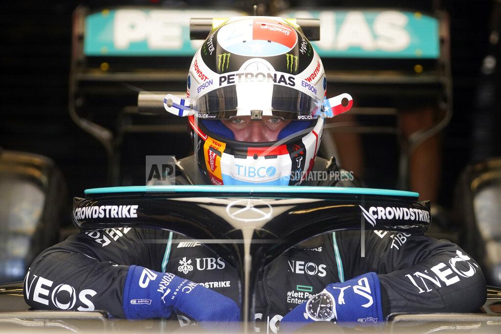 Darron Cummings Mercedes driver Valtteri Bottas, of Finland, climbs into his car during a practice session for the Formula One U.S. Grand Prix auto race at the Circuit of the Americas, Saturday, Oct. 23, 2021, in Austin, Texas. (AP Photo/Darron Cummings)