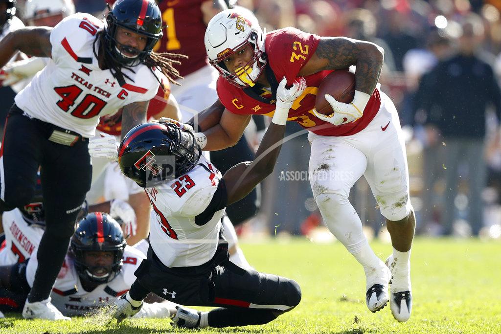 Charlie Neibergall Iowa State running back David Montgomery (32) breaks a tackle by Texas Tech defensive back Damarcus Fields (23) during the first half of an NCAA college football game, Saturday, Oct. 27, 2018, in Ames, Iowa. (AP Photo/Charlie Neibergall)