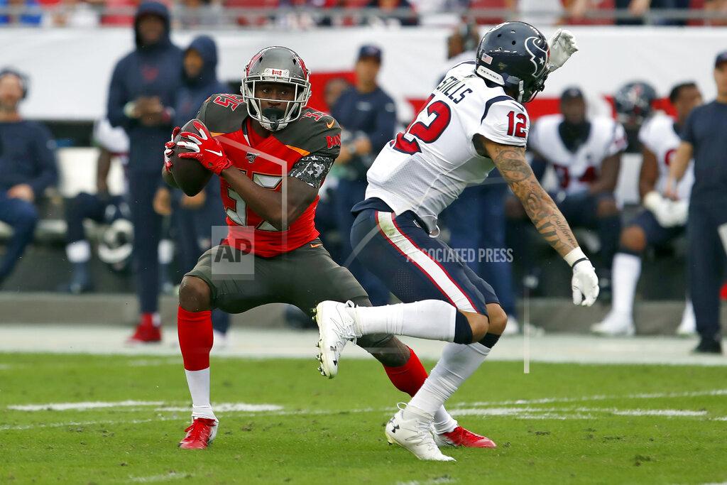 Mark Lomoglio Tampa Bay Buccaneers defensive back Jamel Dean (35) intercepts a pass intended for Houston Texans wide receiver Kenny Stills (12) during the first half of an NFL football game Saturday, Dec. 21, 2019, in Tampa, Fla. (AP Photo/Mark LoMoglio)