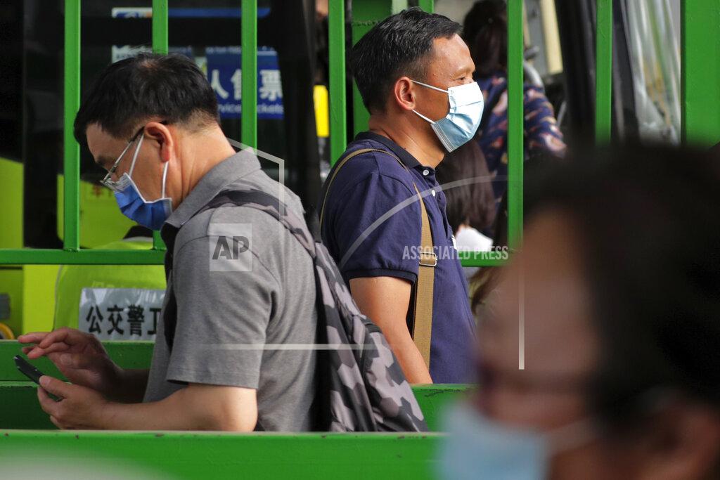 Andy Wong Commuters wearing protective face masks to help curb the spread of the new coronavirus line up to board a bus at a bus terminal in Beijing, Monday, June 22, 2020. A Beijing government spokesperson said the city has contained the momentum of a recent coronavirus outbreak that has infected a few hundreds of people, after the number of daily new cases fell to single digits. (AP Photo/Andy Wong)