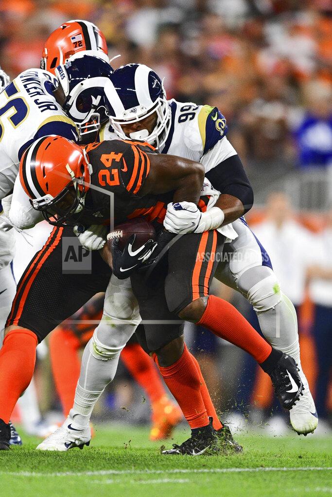 David Dermer Los Angeles Rams defensive tackle Aaron Donald (99) tackles Cleveland Browns running back Nick Chubb (24) during the first half of an NFL football game, Sunday, Sept. 22, 2019, in Cleveland. (AP Photo/David Dermer)