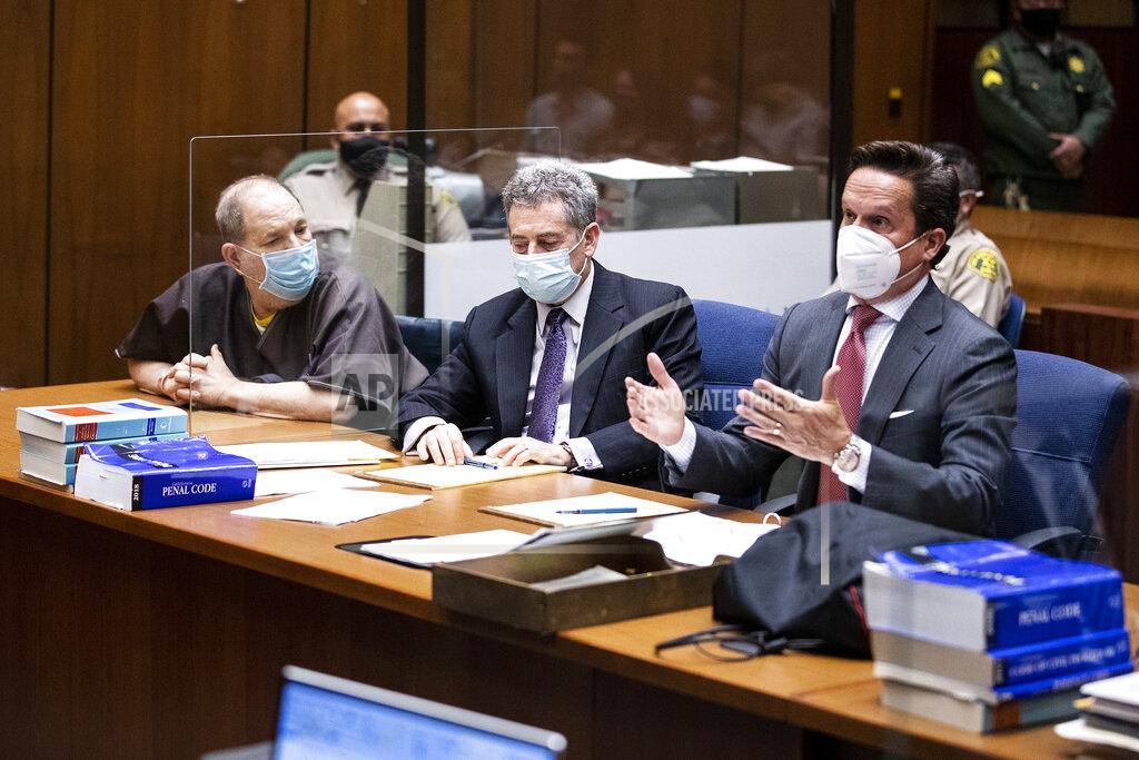 Etienne Laurent Harvey Weinstein, the 69-year-old convicted rapist and disgraced movie mogul, left, sits with his attorneys Mark Werksman, center, and attorney Alan Jackson, during a pre-trial hearing in Los Angeles, Thursday, 29 July 2021. (Etienne Laurent/Pool Photo via AP)