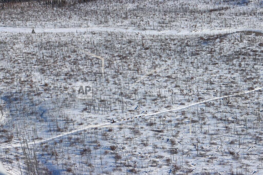 Zachariah Hughes One of the frontrunning teams heads toward the Rohn checkpoint during the Iditarod Trail Sled Dog Race on Saturday, March 13, 2021, in Alaska. (Zachariah Hughes/Anchorage Daily News via AP, Pool)