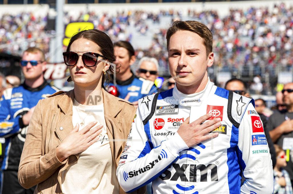 Mike Caudill Christopher Bell puts his hand over his heart for the playing of the national anthem at a NASCAR Cup Series auto race at Richmond Raceway on Sunday, April 3, 2022, in Richmond, Va. (AP Photo/Mike Caudill)