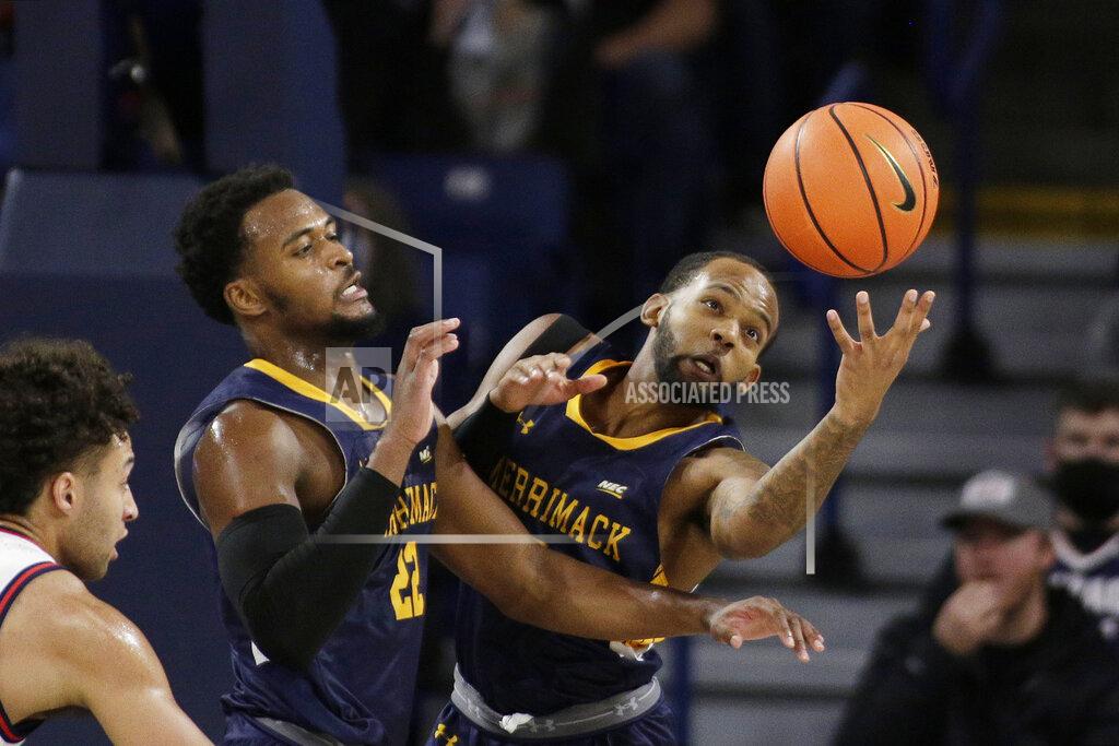 Young Kwak Merrimack guard Mikey Watkins, right, goes after a rebound next to teammate Jordan Minor during the first half of an NCAA college basketball game against Gonzaga, Thursday, Dec. 9, 2021, in Spokane, Wash. (AP Photo/Young Kwak)