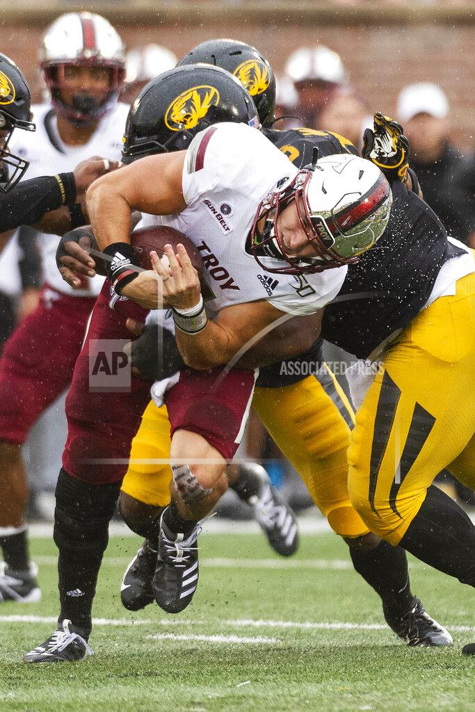 L.g. Patterson Troy quarterback Kaleb Barker is tackled by Missouri defensive lineman Kobie Whiteside during the first half of an NCAA college football game Saturday, Oct. 5, 2019, in Columbia, Mo. (AP Photo/L.G. Patterson)