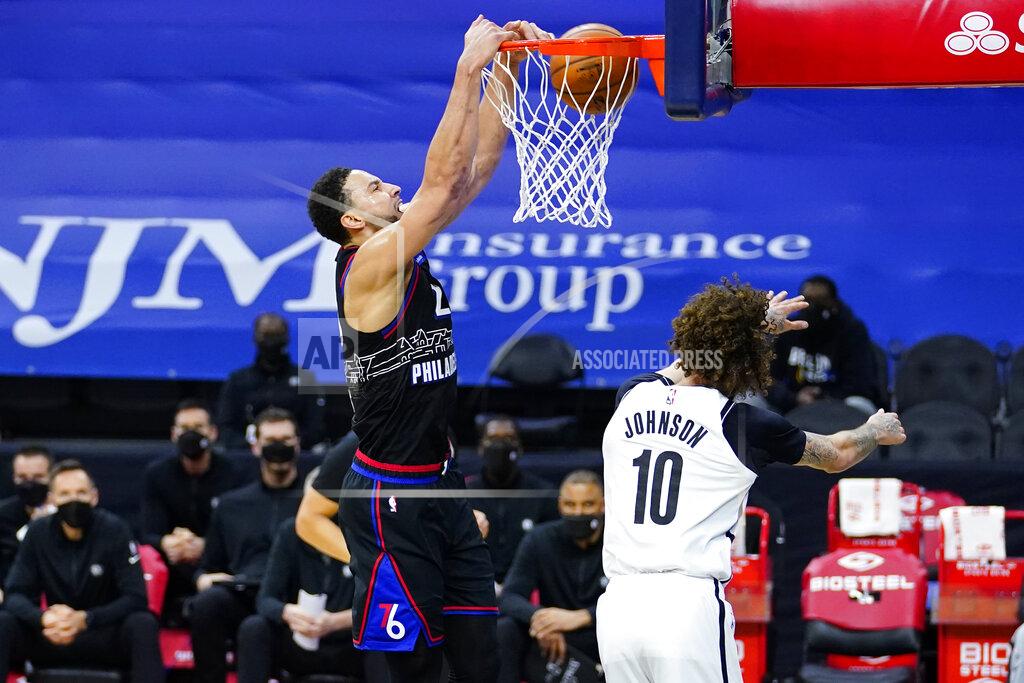 Matt Slocum Philadelphia 76ers' Ben Simmons, left, dunks the ball against Brooklyn Nets' Iman Shumpert during the second half of an NBA basketball game, Saturday, Feb. 6, 2021, in Philadelphia. (AP Photo/Matt Slocum)