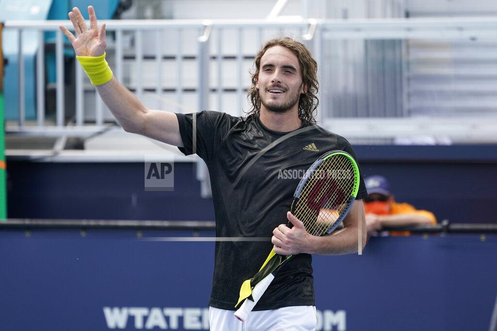Marta Lavandier Stefanos Tsitsipas of Greece waves to the crowd after defeating Damir Dzumhur of Bosnia during the Miami Open tennis tournament, Saturday, March 27, 2021, in Miami Gardens, Fla.
(AP Photo/Marta Lavandier)