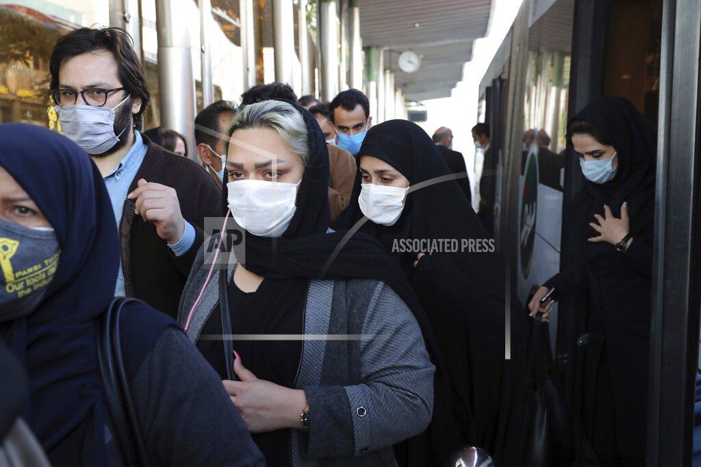 Ebrahim Noroozi FILE - In this Sunday, Oct. 11, 2020 file photo, people wear protective face masks to help prevent the spread of the coronavirus in downtown Tehran, Iran. For the second day in a row, Iran announced Monday its highest single-day death toll from the coronavirus with 272 people killed. The announcement by Health Ministry spokeswoman Sima Sadat Lari saw Iran also give its single-day highest count of new cases with 4,206 new patients.(AP Photo/Ebrahim Noroozi, File)