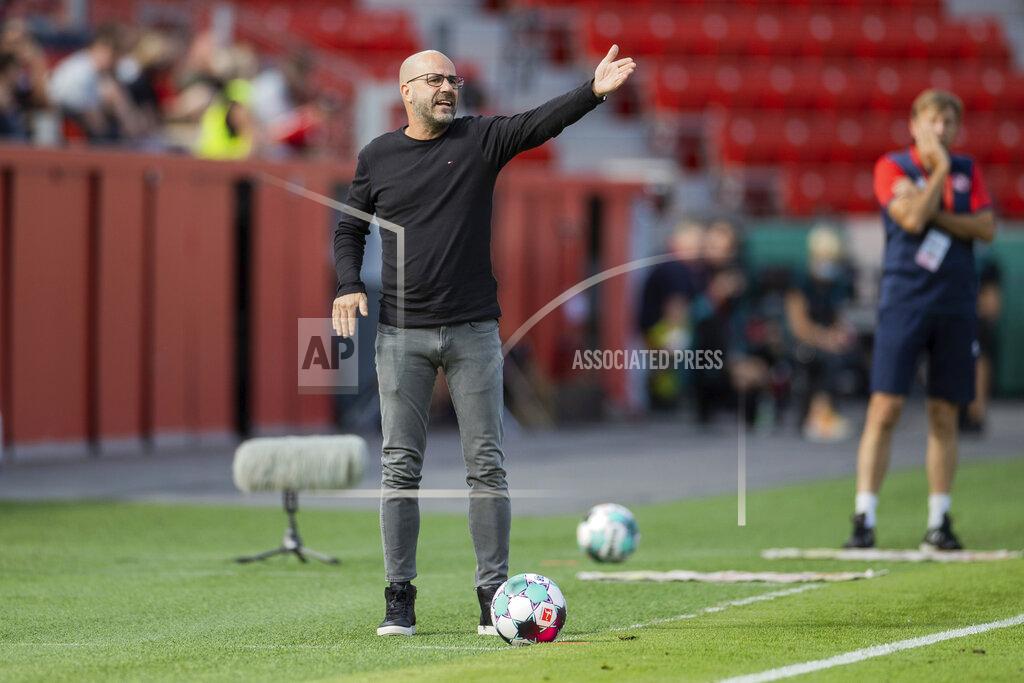 Rolf Vennenbernd Leverkusen's head coach Peter Bosz gestures during the German Soccer Cup first round match between Bayer 04 Leverkusen and Eintracht Norderstedt in Leverkusen, Germany, Sunday, Sept. 13, 2020. (Rolf Vennenbernd/dpa via AP)