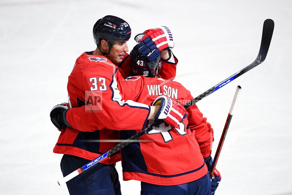 Nick Wass CORRECTS GOAL SCORED TO RICHARD PANIK - Washington Capitals right wing Tom Wilson (43) celebrates with defenseman Zdeno Chara (33) after teammate Richard Panik's goal during the second period of an NHL hockey game against the Boston Bruins, Saturday, Jan. 30, 2021, in Washington. (AP Photo/Nick Wass)