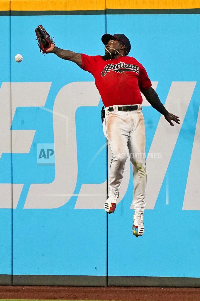 Tony Dejak Cleveland Indians' Daniel Johnson jumps but can't get to a triple hit by Tampa Bay Rays' Francisco Mejia during the seventh inning of a baseball game Thursday, July 22, 2021, in Cleveland. (AP Photo/Tony Dejak)