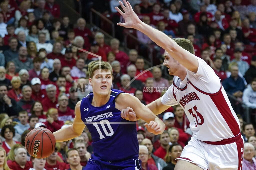 Andy Manis Northwestern's Miller Kopp (10) drives against Wisconsin's Nate Reuvers (35) during the first half of an NCAA college basketball game Wednesday, March 4, 2020, in Madison, Wis. (AP Photo/Andy Manis)