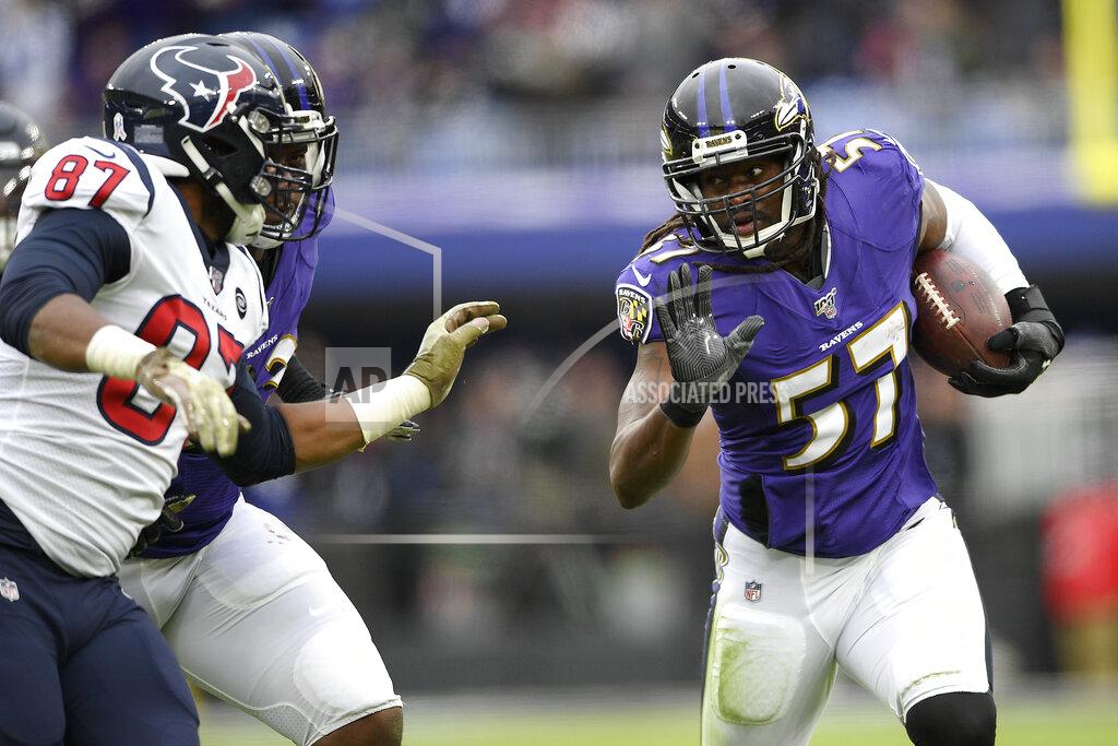 Nick Wass Baltimore Ravens middle linebacker Josh Bynes (57) runs with the ball as Houston Texans tight end Darren Fells (87) tries to stop him after Bynes intercepted a pass from Texans quarterback Deshaun Watson, not visible, during the second half of an NFL football game, Sunday, Nov. 17, 2019, in Baltimore. (AP Photo/Nick Wass)