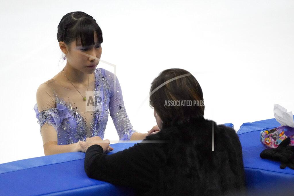 Mark Schiefelbein Mai Mihara of Japan talks with her coach while competing in the women's short program competition at the Asian Open Figure Skating Trophy, a test event for the 2022 Winter Olympics, at the Capital Indoor Stadium in Beijing, Thursday, Oct. 14, 2021. (AP Photo/Mark Schiefelbein)