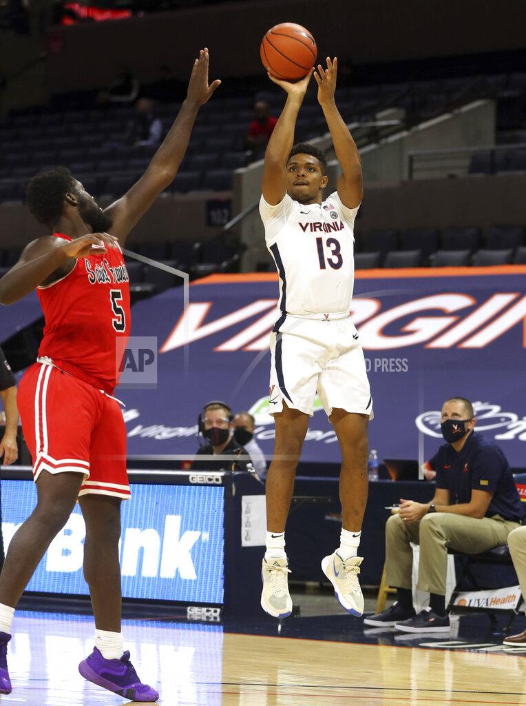 Andrew Shurtleff Virginia guard Casey Morsell (13) shoots over St. Francis forward Myles Thompson (5) during an NCAA college basketball game Tuesday, Dec. 1, 2020, in Charlottesville, Va. (Andrew Shurtleff/The Daily Progress via AP)