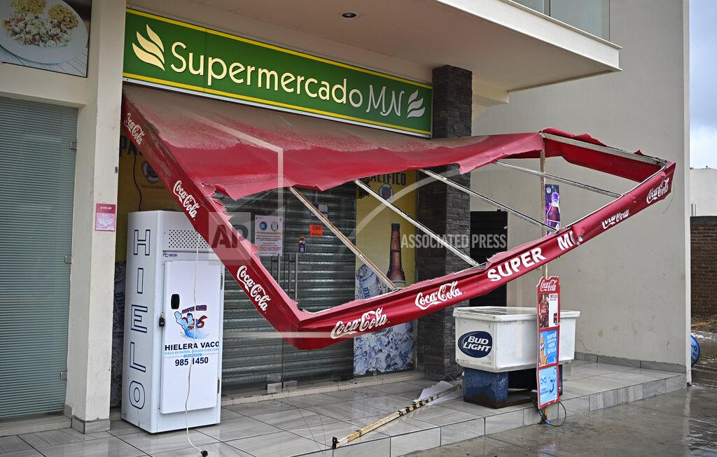 Roberto Echeagaray A market's awning is damaged after the passing of Hurricane Pamela in Mazatlan, Mexico, Wednesday, Oct. 13, 2021. Pamela made landfall on Mexico's Pacific coast just north of Mazatlan on Wednesday, bringing high winds and rain to the port city. (AP Photo/Roberto Echeagaray)