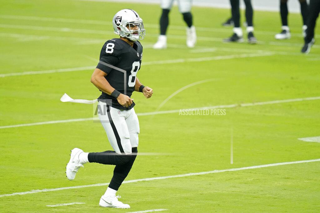 John Locher Las Vegas Raiders quarterback Marcus Mariota (8) runs down the field during an NFL football training camp practice Friday, Aug. 21, 2020, in Las Vegas. (AP Photo/John Locher)