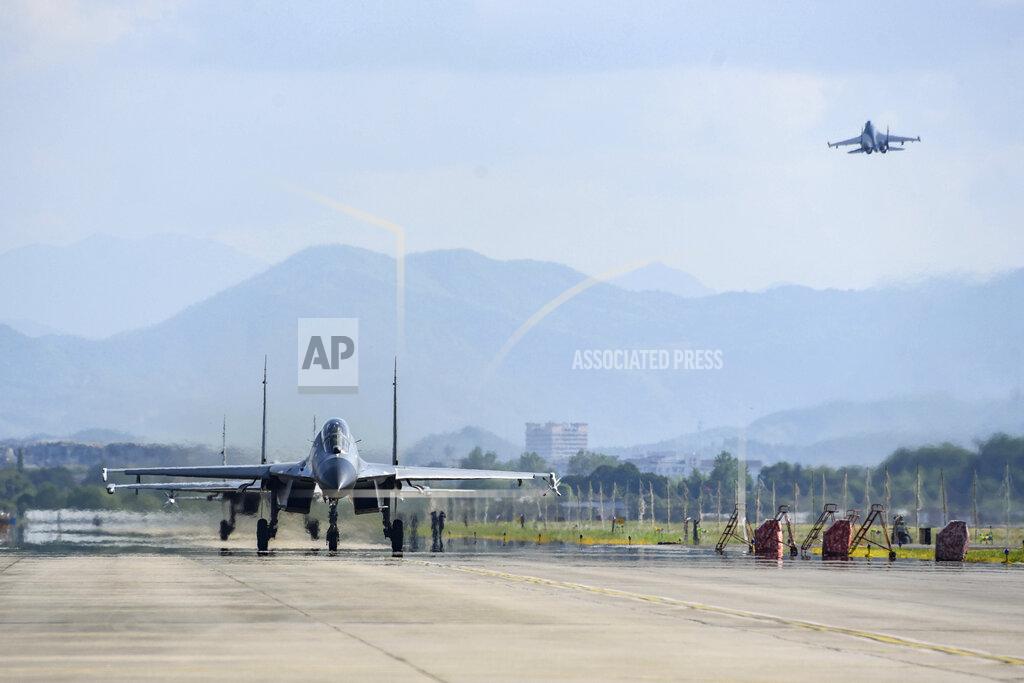 Fu Gan In this photo released by China's Xinhua News Agency, air force and naval aviation corps of the Eastern Theater Command of the Chinese People's Liberation Army (PLA) fly planes at an unspecified location in China, Thursday, Aug. 4, 2022. China conducted "precision missile strikes" Thursday in waters off Taiwan's coasts as part of military exercises that have raised tensions in the region to their highest level in decades following a visit by U.S. House Speaker Nancy Pelosi. (Fu Gan/Xinhua via AP)