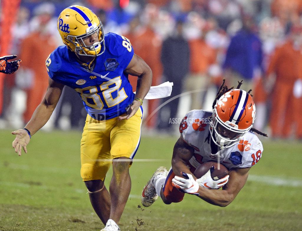 Mike Mccarn Clemson's T.J. Chase (18) catches a punt intended for Pittsburgh's Rafael Araujo-Lopes (82) in the second half of the Atlantic Coast Conference championship NCAA college football game in Charlotte, N.C., Saturday, Dec. 1, 2018. Chase was called for interference with a fair catch on the play. (AP Photo/Mike McCarn)